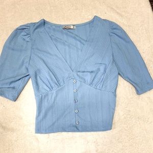 Size small, light blue, deep plunge v neck top